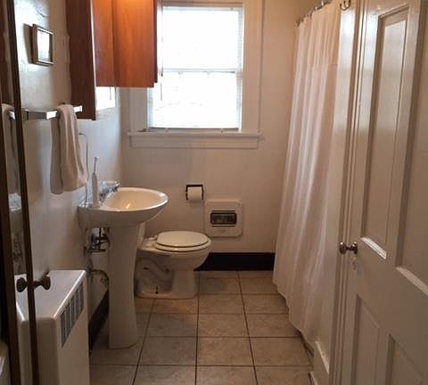 Full bathroom with large closet