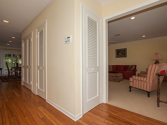Entry hall into home w/ bamboo wood floors.