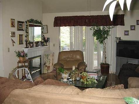 great room w/ laminate flooring and slider to the back yard