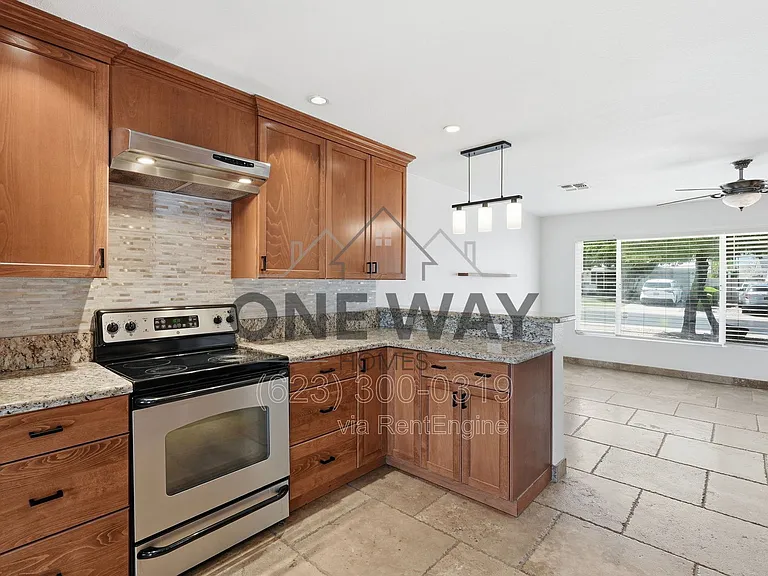 8702 E Sheridan St — Photo 12
