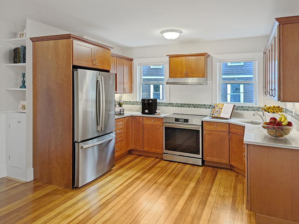 Eat-in kitchen with brand new cabinets, countertop, and stainless steel appliances