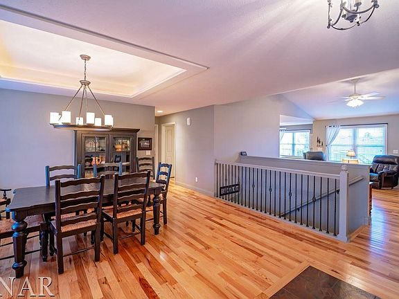 Open floor plan, trey ceiling with indirect lighting, Pottery Barn chandelier