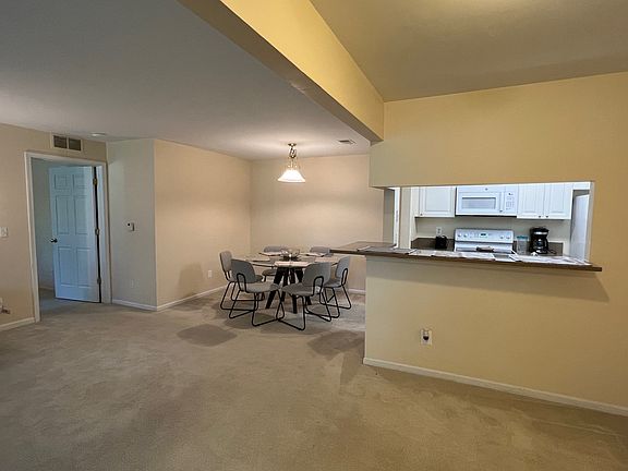 Overview showcases dinning room and living room