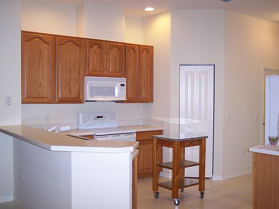 Kitchen w/snack bar into Family Room