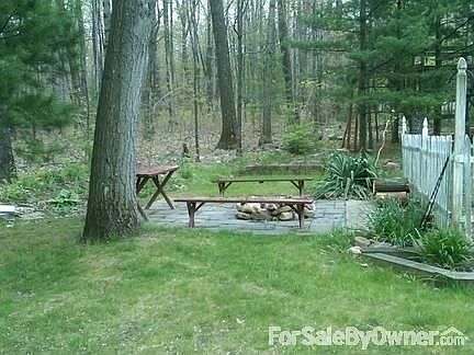 Back yard
						:
						Fire pit, woods, garden, play area
