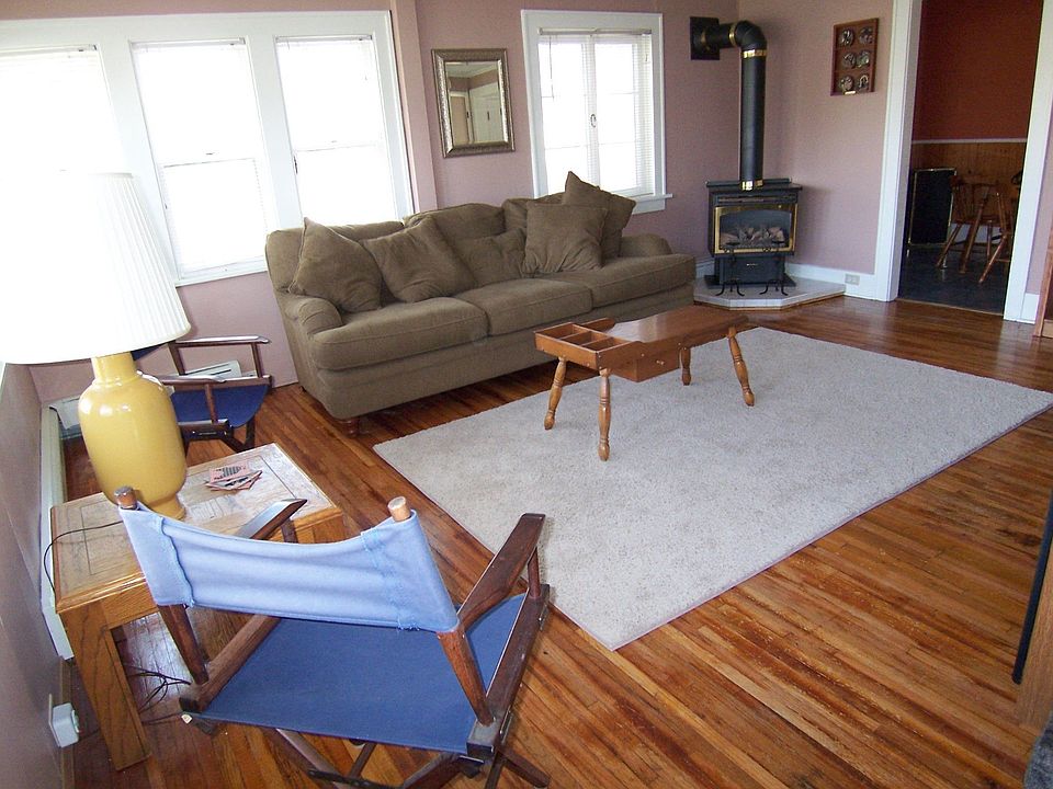 Hardwood floors in LR, plus gas fireplace that looks like a woodstove!