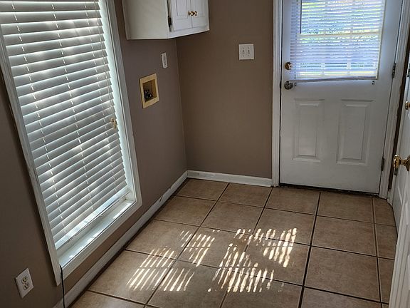 Laundry room with washer & dryer hook-up. Cabinets for supplies. Plus a closet for home equipment with rack to hang equipent.