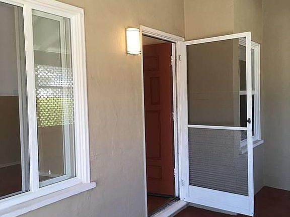 enclosed patio mudroom leads to front door