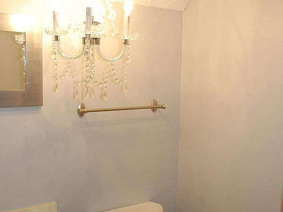 Half bath on main level off kitchen has new toilet and light