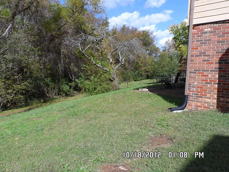 Back yard backs to woods. Has patio
