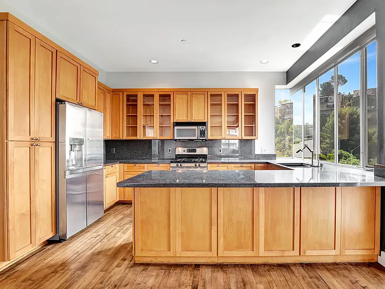 Large kitchen with plentiful cabinet space and stainless steel appliances