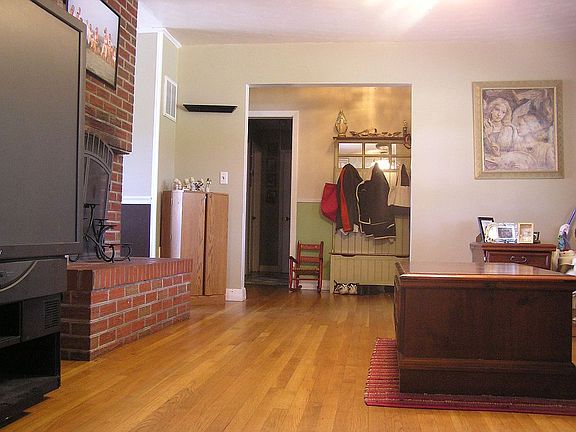 Sunlight pours into the open family room, which centers on the fireplace.
