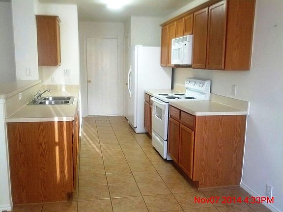 Kitchen with pantry leads to laundry room and garage