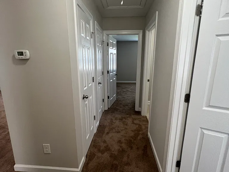 Hallway with closets for linen, etc.