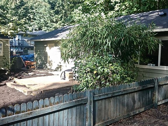 fenched yard with shed for storage