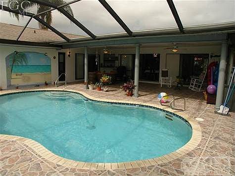 The pool is warm and the weather is 83 degrees. Why not live the good life here! Affordable Florida living at it's best! Gulf access canal in your back yard for your sailboat or powerboat. Low cost living, no assessments to pay, city water and city sewer paid in full! Convenient to everything!