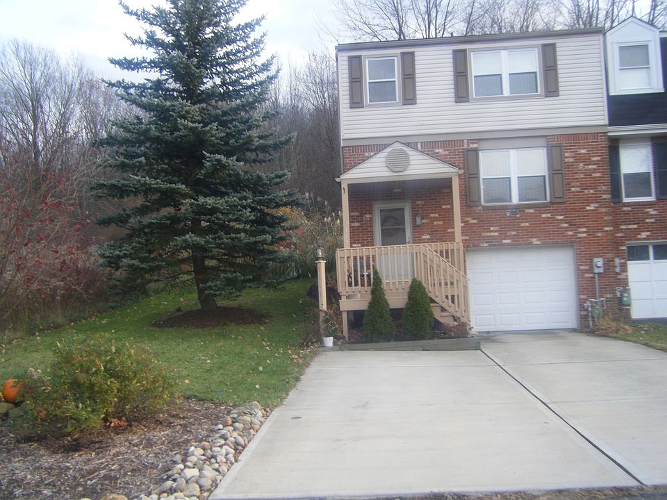 End unit with garage and parking space