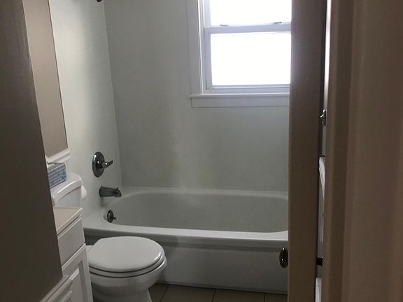 Updated shower and bathtub area with newer bathroom fixtures. Bathroom had tile floor