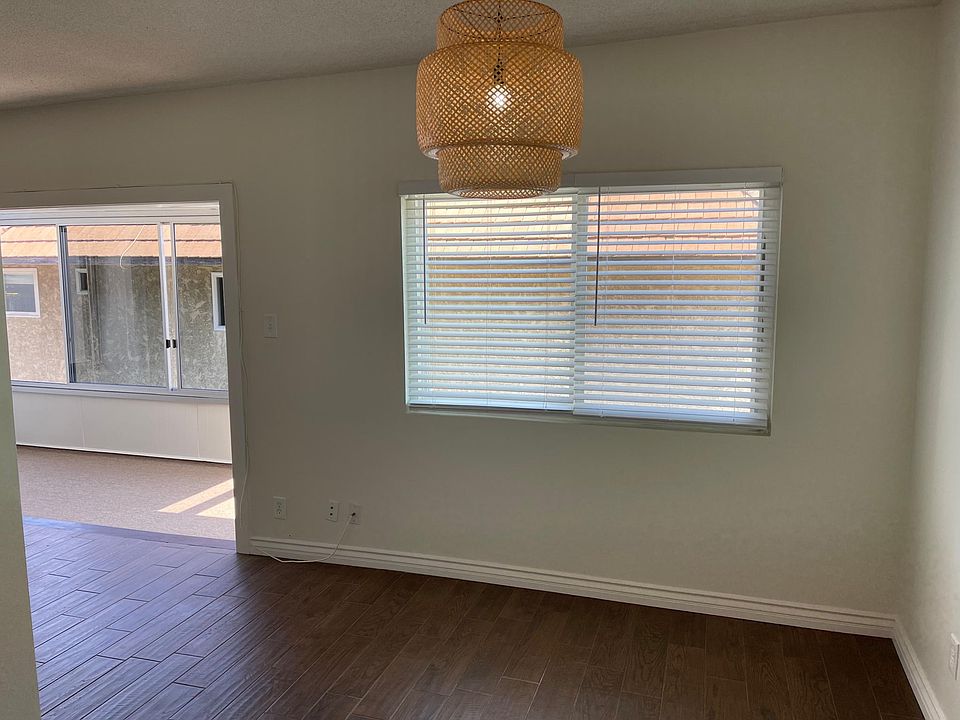 Dining room area, adjacent to living room and kitchen.