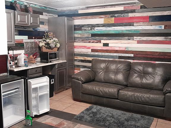 The kitchen does not have an oven it has an air fryer , microwave and a drop in cooktop that is located on the counter.