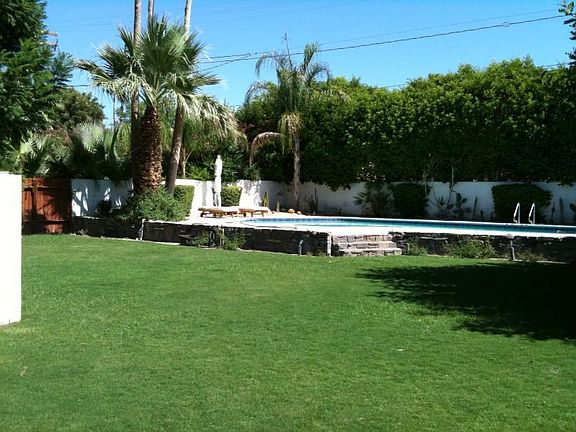 Rock wall surrounds elevated pool