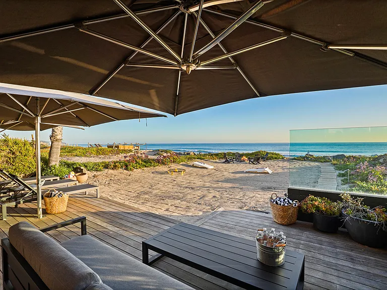 Stretch out on streamlined loungers, just steps from the sand.