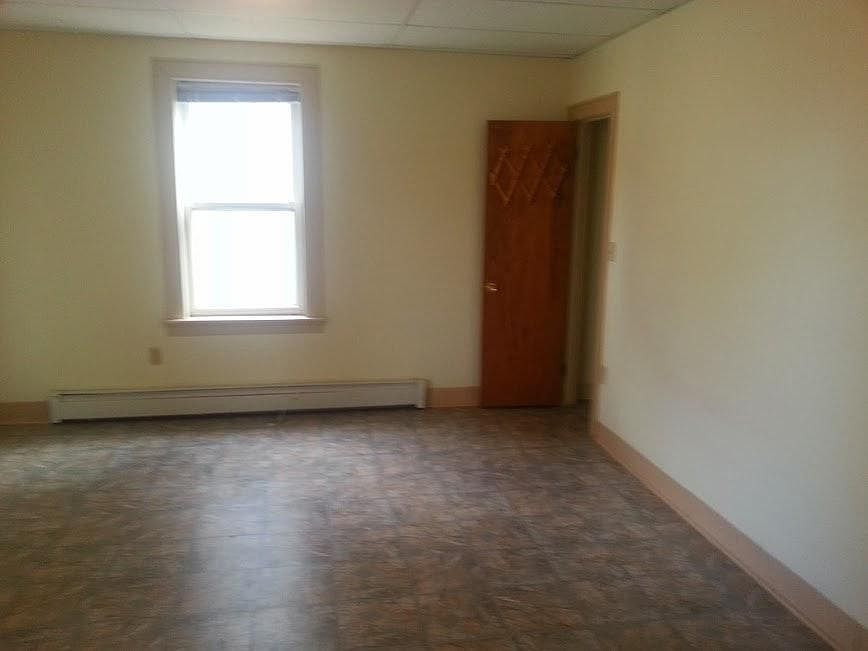 one side of master bedroom, closest to the back of the house