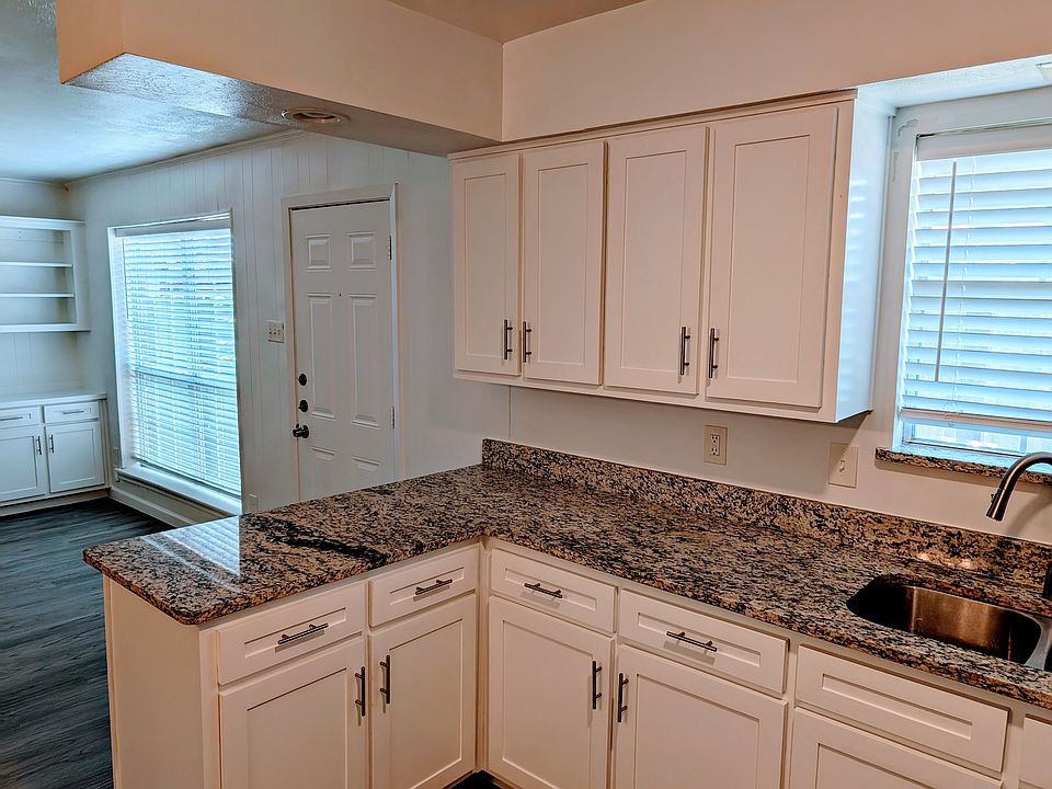 Kitchen area with lots of cabinets