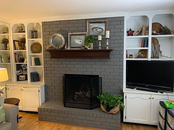 Gas log fireplace, shelves and storage