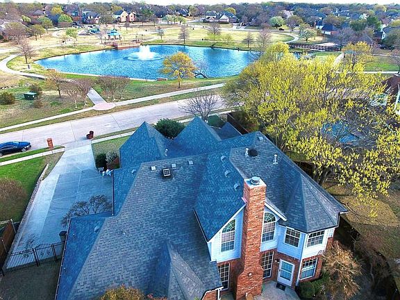 WALKING TRAILS AND PARK ACROSS THE STREET. NOTICE THE OVERSIZE DRIVEWAY.