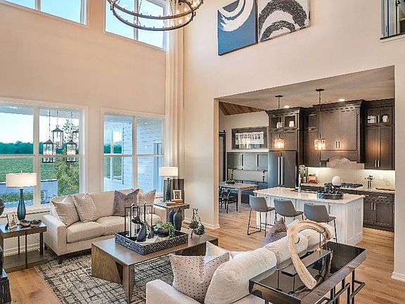 Open-concept kitchen, casual dining area, and living room