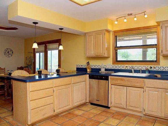 Large kitchen is bright and open w/stainless appliances.