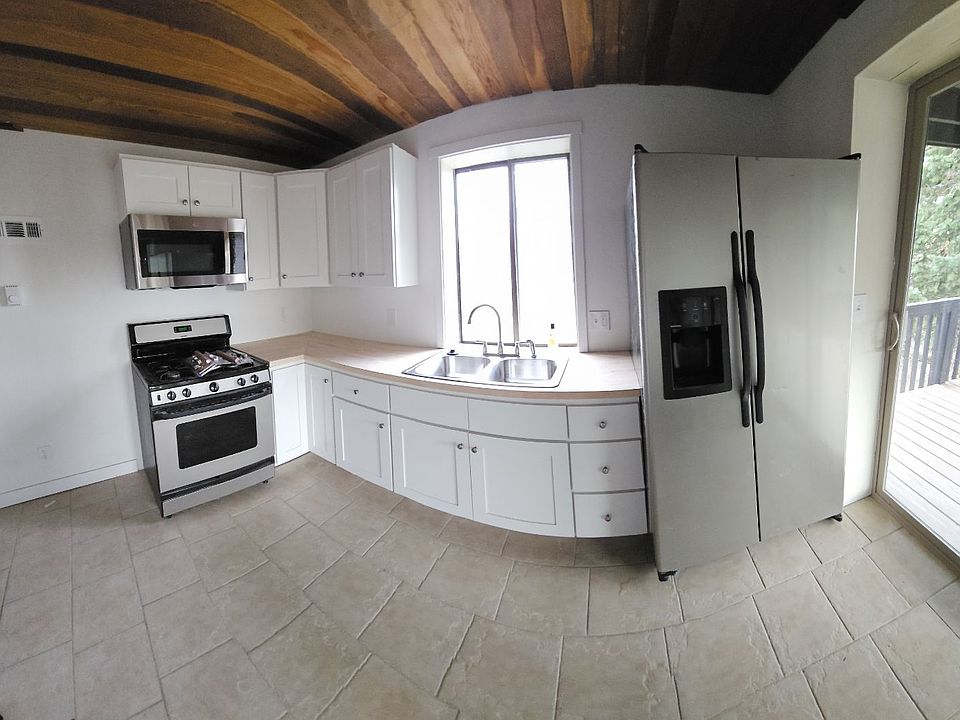 Kitchen has sliders to deck.