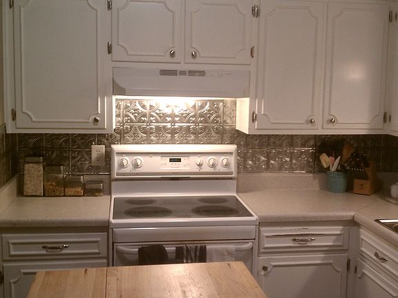 Current cabinets with oven/stove. Drawer and cabinet faces to be replaced soon