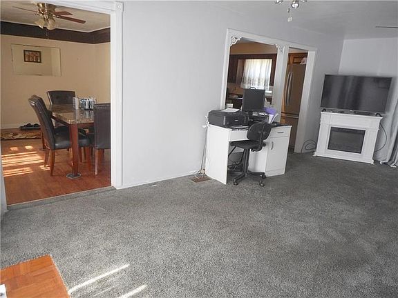 Living Room: Never miss out on a conversation while grabbing a drink with the easy flow from room to room.