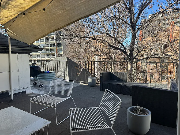 Private outdoor deck overlooking back yard.