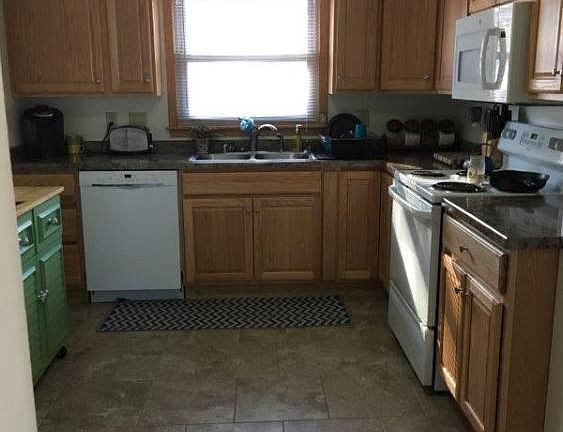Kitchen - full-size electric stove, built-in microwave, dishwasher, and garbage disposal
