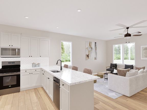 The foyer welcomes you into a spacious open-concept