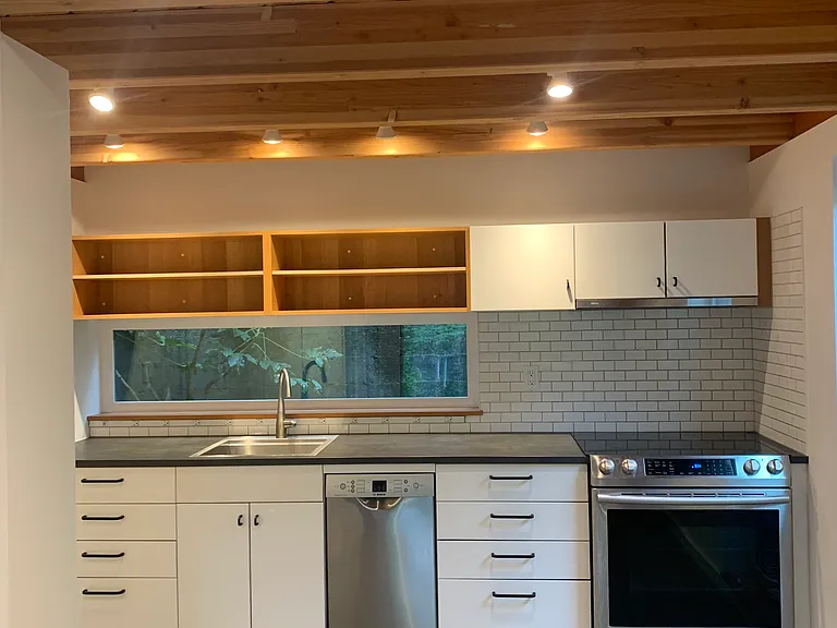 Kitchen with dishwasher and electric stove.