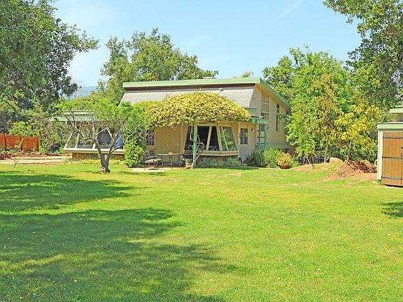 Expansive front yard on a 3 acre hilltop.