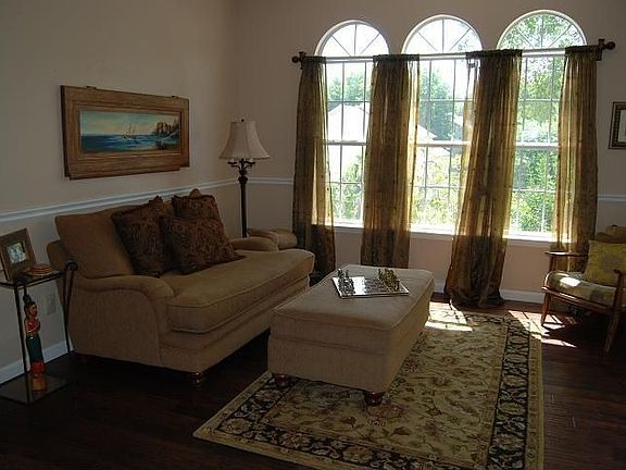 Formal Living Room with Large Windows Facing Front Yard