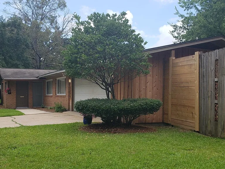 Enclosed garage fenced yard