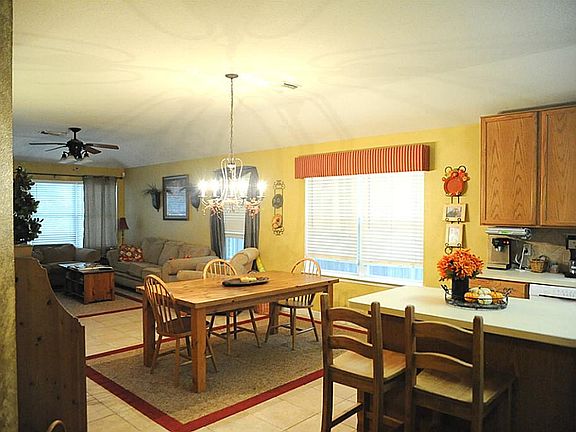 Entry into the home leads to an open and spacious living area where kitchen, dining and family time 