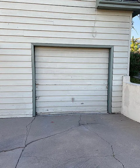 Single car garage off alley in the back of the lot.