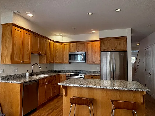 Kitchen with granite counters and oak cabinets