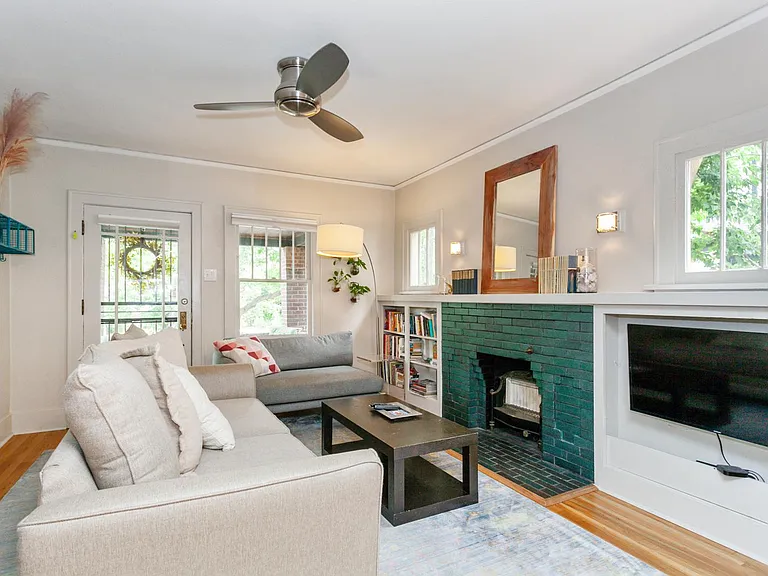 The living room, w/ Apple TV, greets you from the front porch.