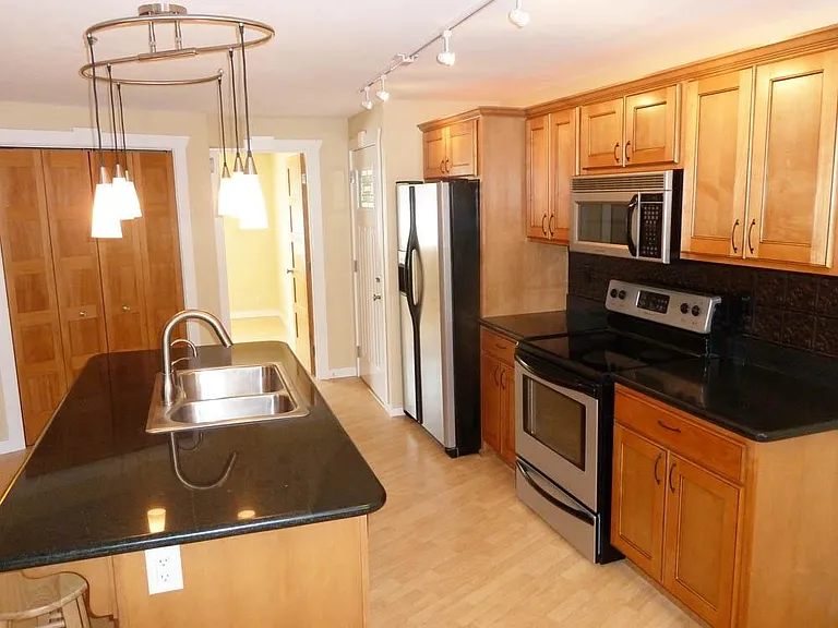 SS, Carmelized Maple Cabinetry