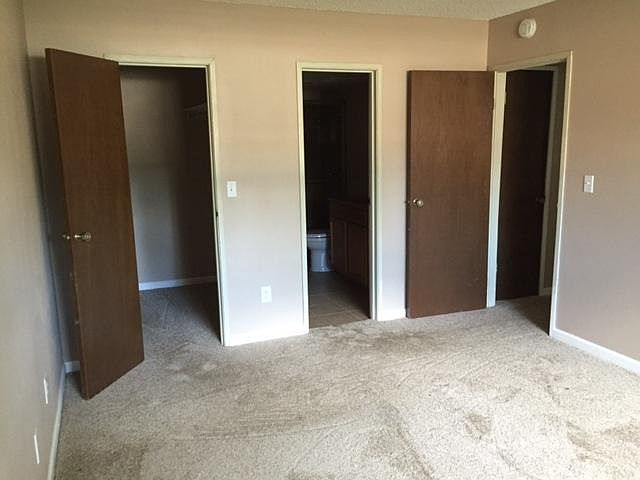 Master Bedroom with walk-in closet and attached bathroom with shower