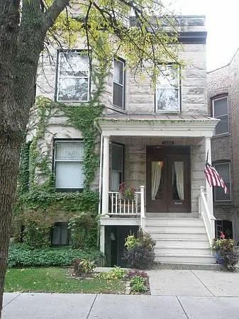 Front of building. Stairs down to garden unit to the left of main stair way up to first floor