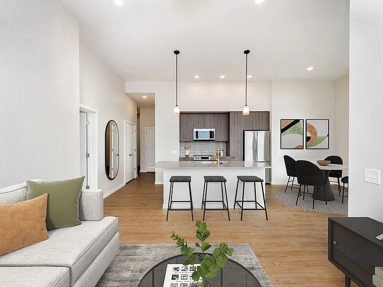 Signature Collection kitchen and living area with hard surface flooring